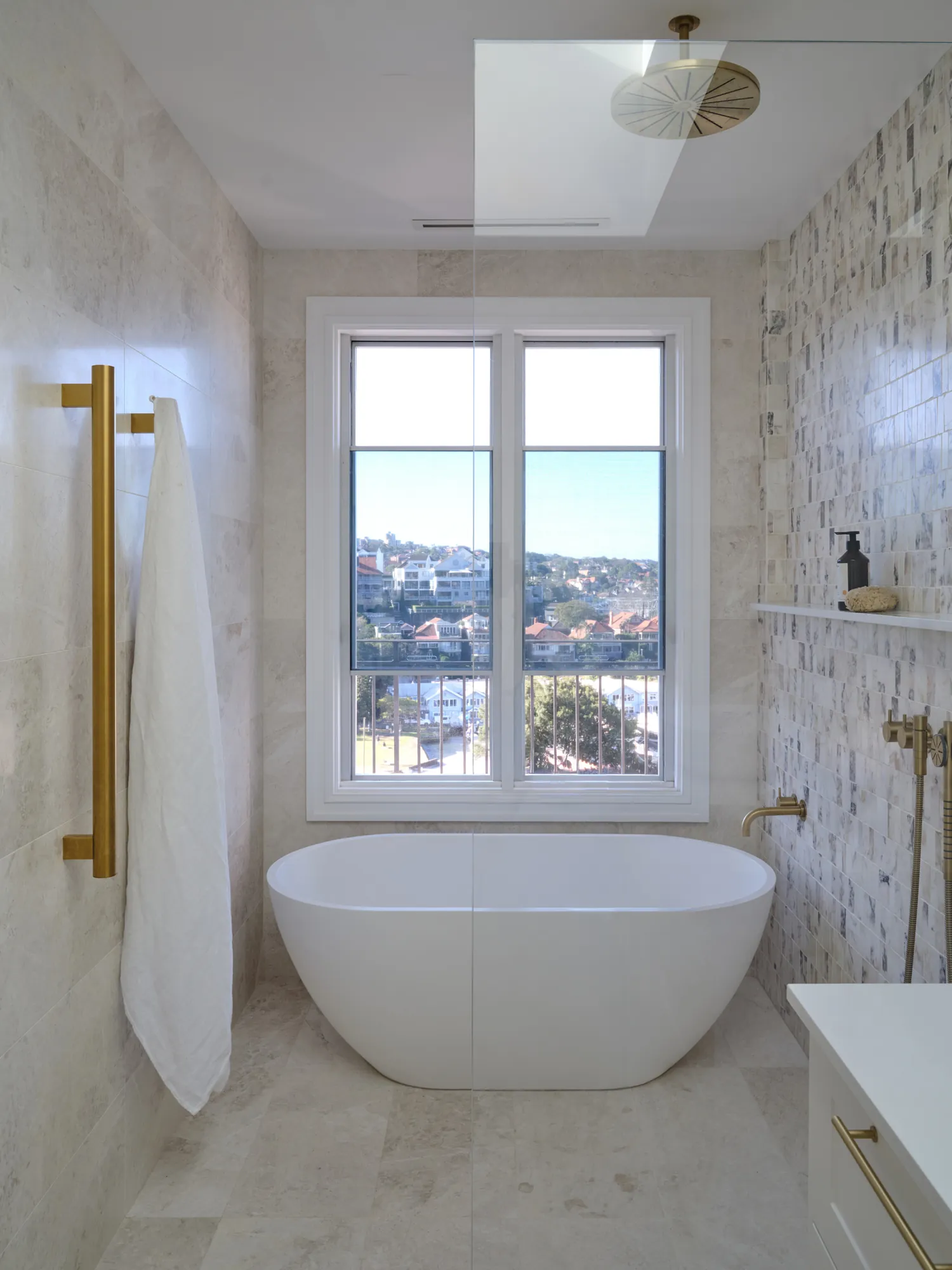 Ensuite bath beneath the harbour window.