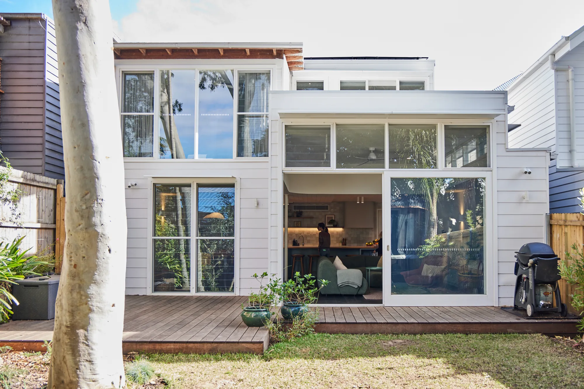 Rear extension opening onto the deck and lawn.
