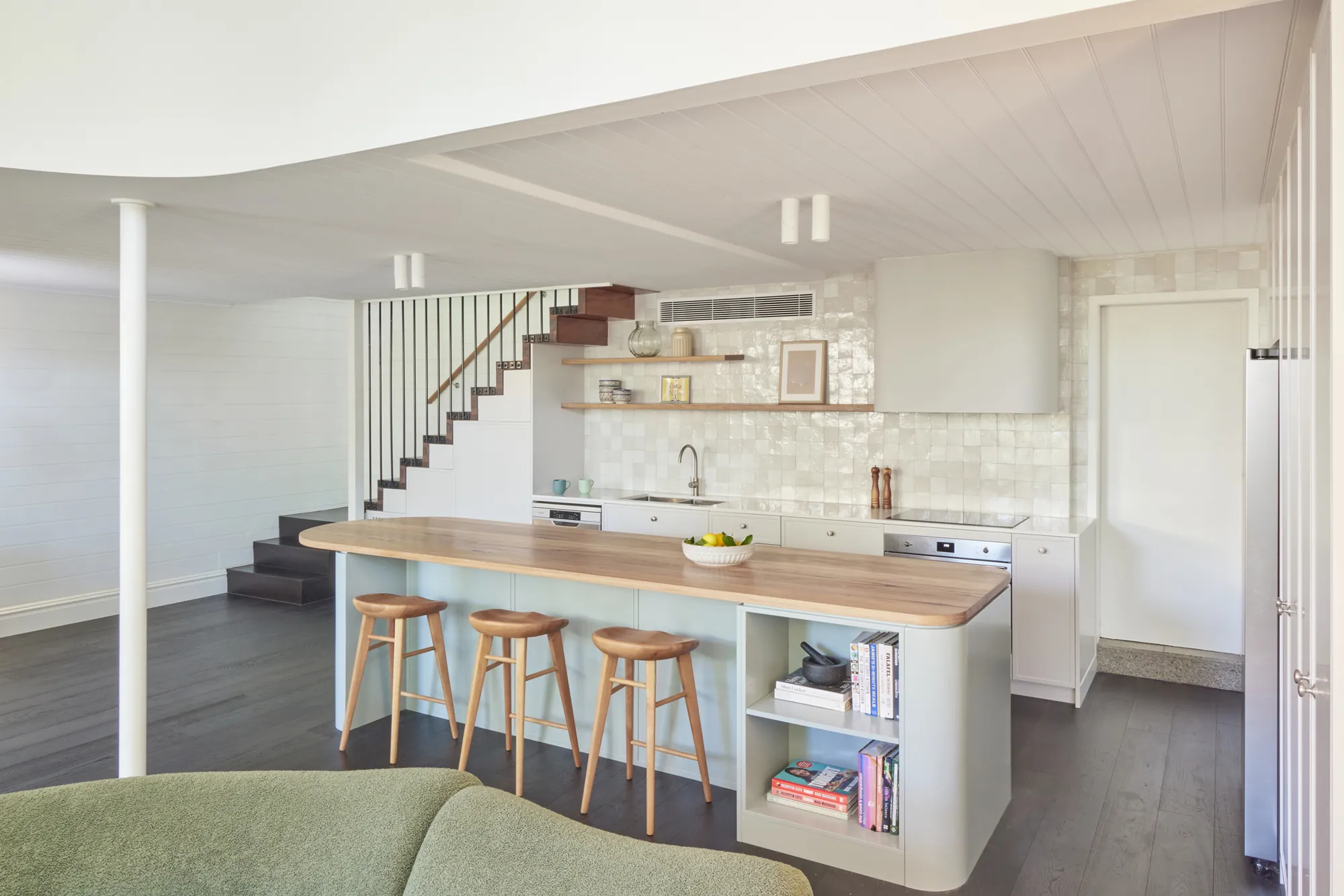 Sage island with timber top and stools.