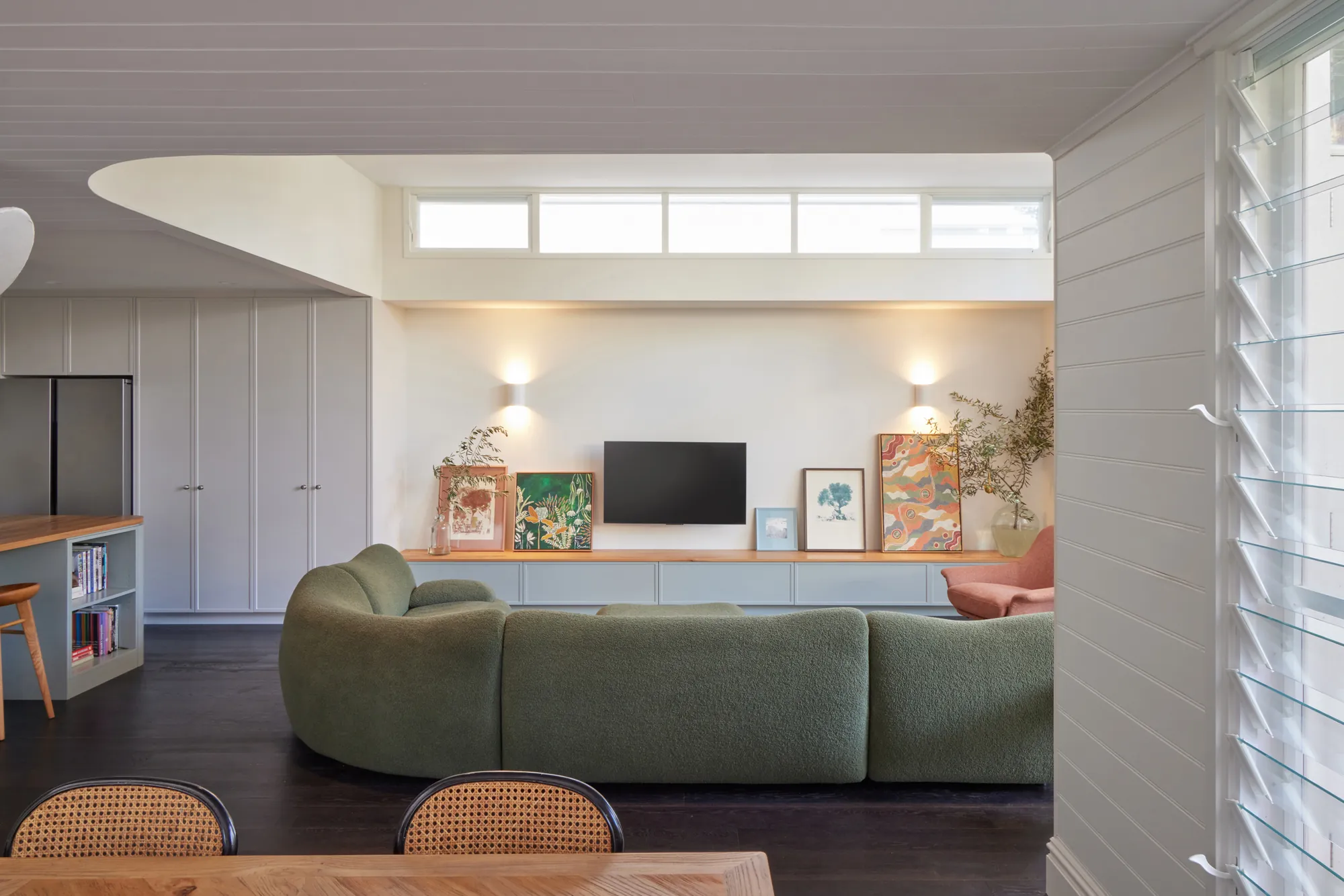 Living room, framed through the louvres.
