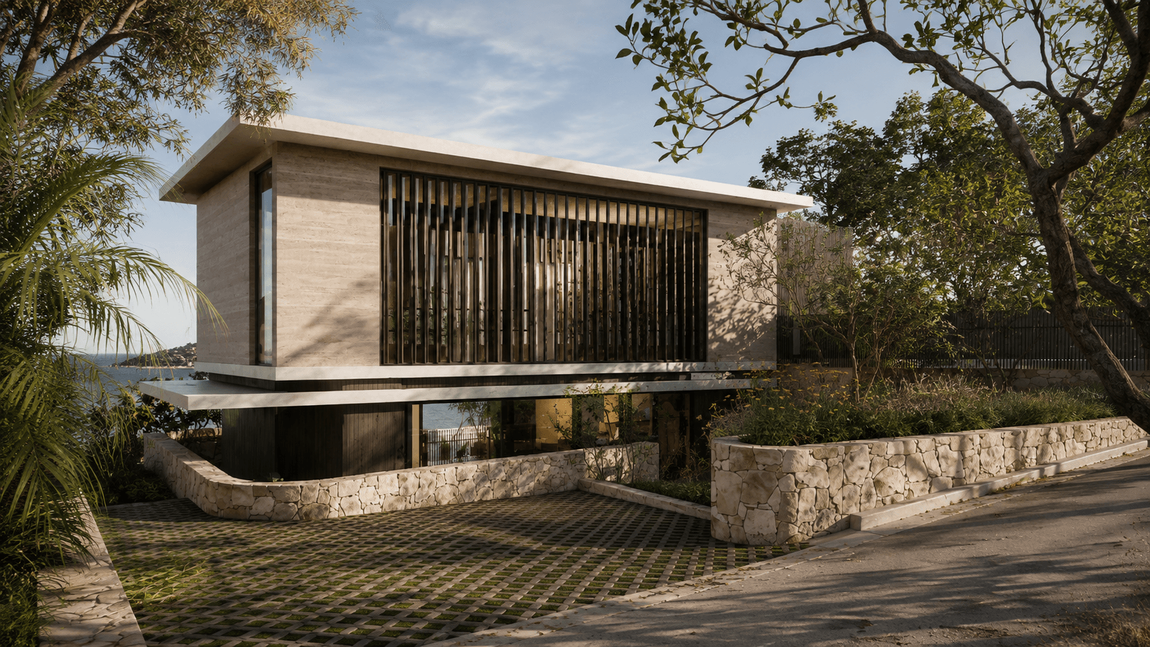 Street view of a contemporary home with a raised concrete form, vertical timber screening, stone retaining walls and mature trees framing the architecture.